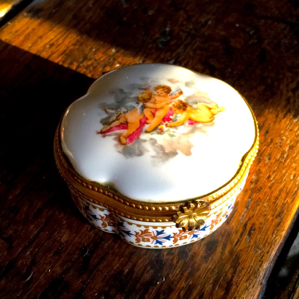 Limoges hinged box with hand painted cherubs